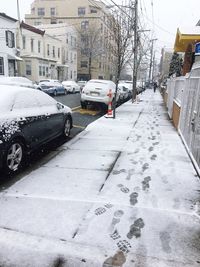 Cars on snow in city