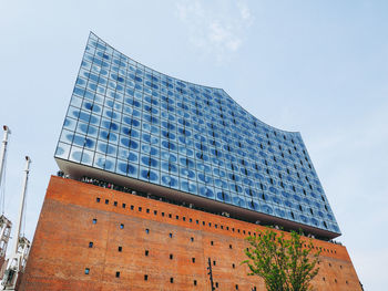 Low angle view of modern building against sky