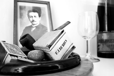 Close-up of man reading book at home