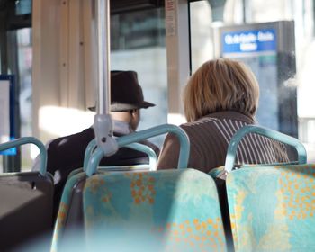 Rear view of people sitting in bus