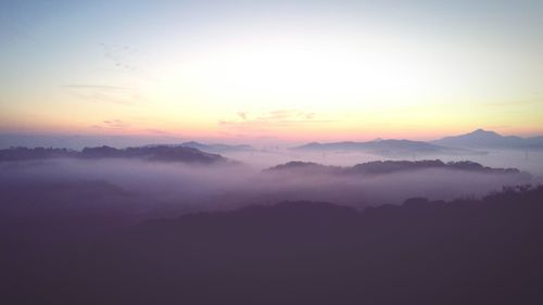 Scenic view of mountains against sky during sunset