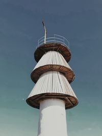 Low angle view of tower against blue sky