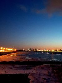 Scenic view of sea against sky at night