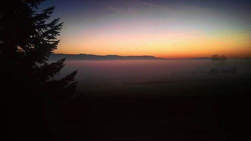 Scenic view of landscape at sunset