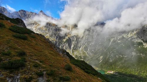 Scenic view of waterfall against sky