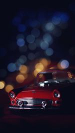 Close-up of toy car at night