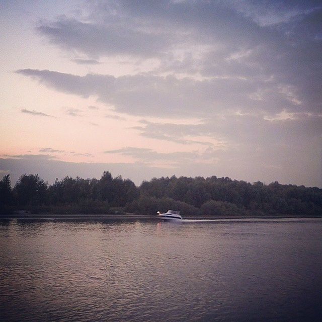 nautical vessel, transportation, water, mode of transport, boat, waterfront, sky, tree, tranquil scene, tranquility, river, cloud - sky, nature, scenics, beauty in nature, lake, sailing, moored, cloud, sunset