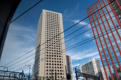 Low angle view of modern buildings against sky