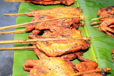 High angle view of meat on barbecue