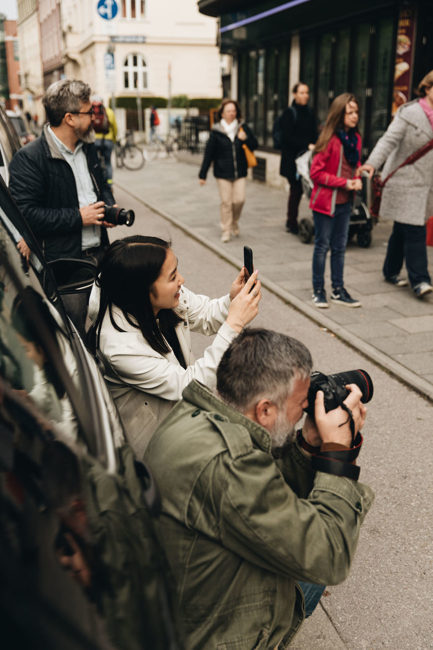 PEOPLE PHOTOGRAPHING ON STREET