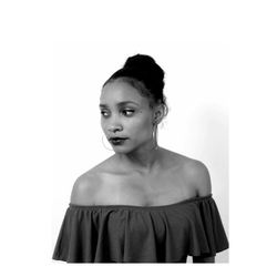 Thoughtful young woman wearing off shoulder against white background