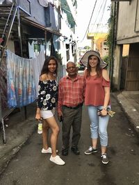 Full length portrait of friends in city