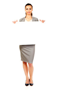 Woman standing against white background