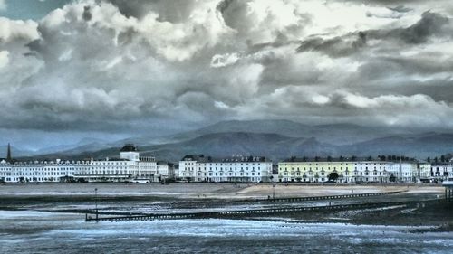 Scenic view of sea against cloudy sky