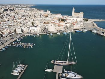 High angle view of harbor by buildings in city