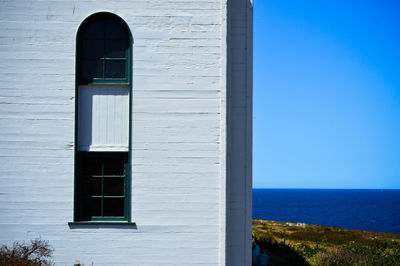 View of built structures against blue sky