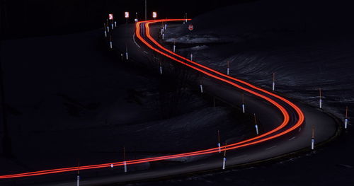 High angle view of light trails on road at night