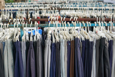 Second hand clothes and pants with quality brands imported from abroad are sold on the roadside.