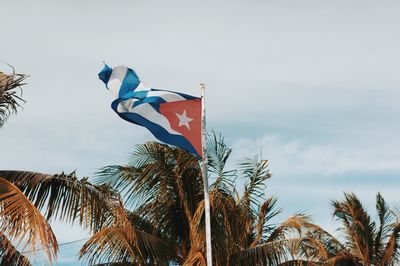 Low angle view of flag against sky