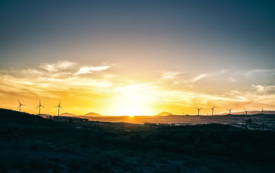 View of landscape against sky during sunset