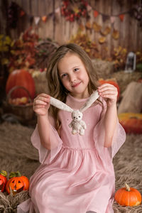 Portrait of smiling young woman standing outdoors