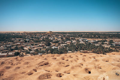 Aerial view of townscape against clear sky