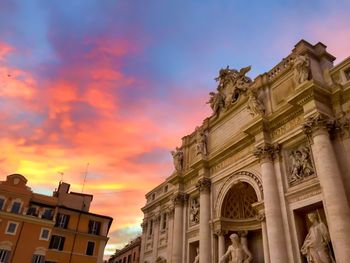 Low angle view of building against sky during sunset