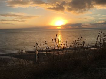 Scenic view of sea against sky during sunset