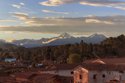 Scenic view of townscape against sky during sunset