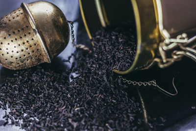 Close-up of black tea and infuser