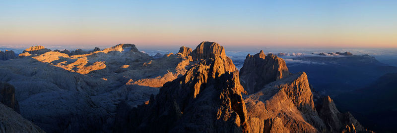 Panoramic view of mountain range against sky during sunset