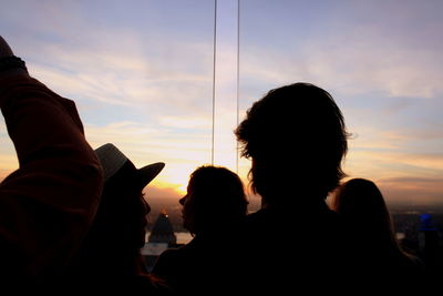 Portrait of silhouette people against sky during sunset