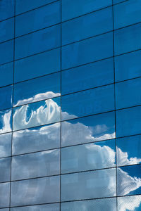 Cloud reflected on side of building