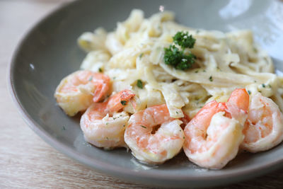 Close-up of pasta served in plate on table