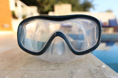 Close-up of reflection on table by swimming pool