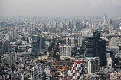 High angle view of modern buildings in city against sky