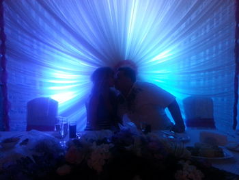 People in illuminated light