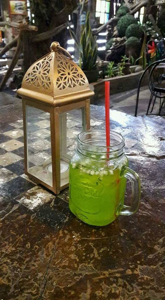 CLOSE-UP OF DRINK ON TABLE AT WATER