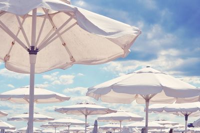 Beach umbrellas against sky