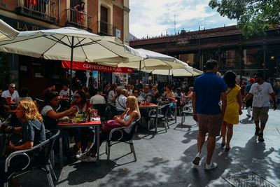 Group of people in town square