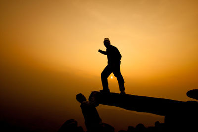 Silhouette people at sunset