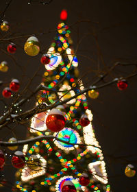 Low angle view of illuminated christmas tree