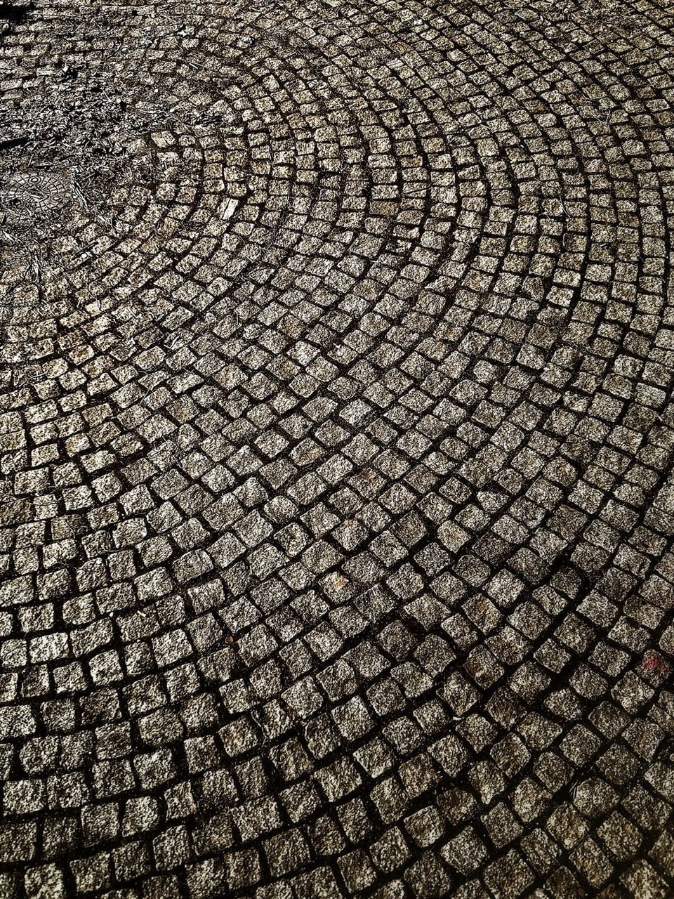 full frame, backgrounds, pattern, cobblestone, textured, high angle view, street, paving stone, repetition, day, outdoors, no people, design, footpath, stone - object, sunlight, close-up, in a row, road, geometric shape