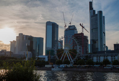 City skyline against cloudy sky
