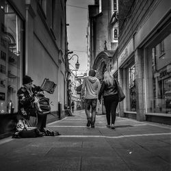 People walking on street in city