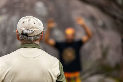 Rear view of man standing outdoors