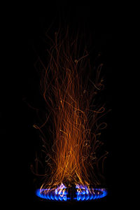 Firework display over black background