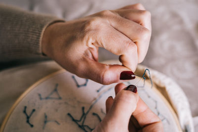 Close-up of woman holding hands