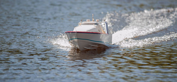 Remote controlled ship model is remote controlled on a lake