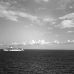 Cruise ship in sea against sky